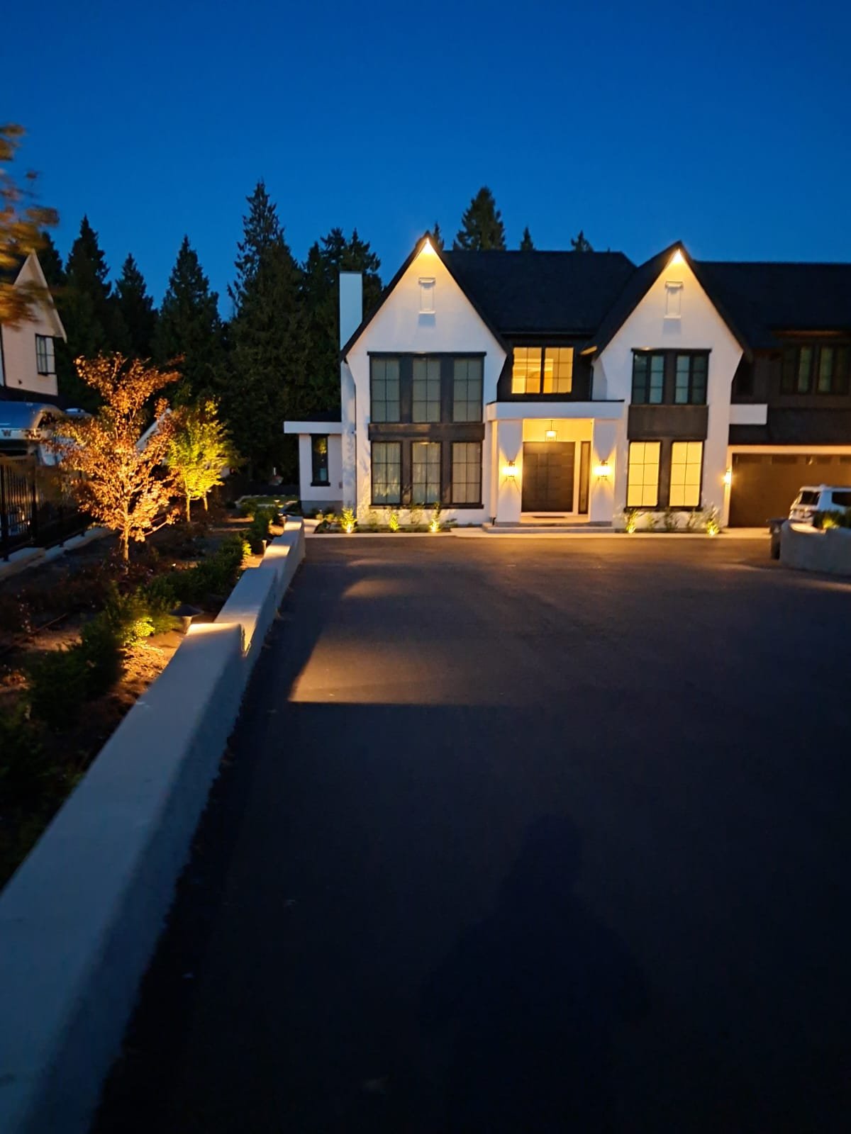 Beautiful outdoor landscape lit up at night with professional lighting